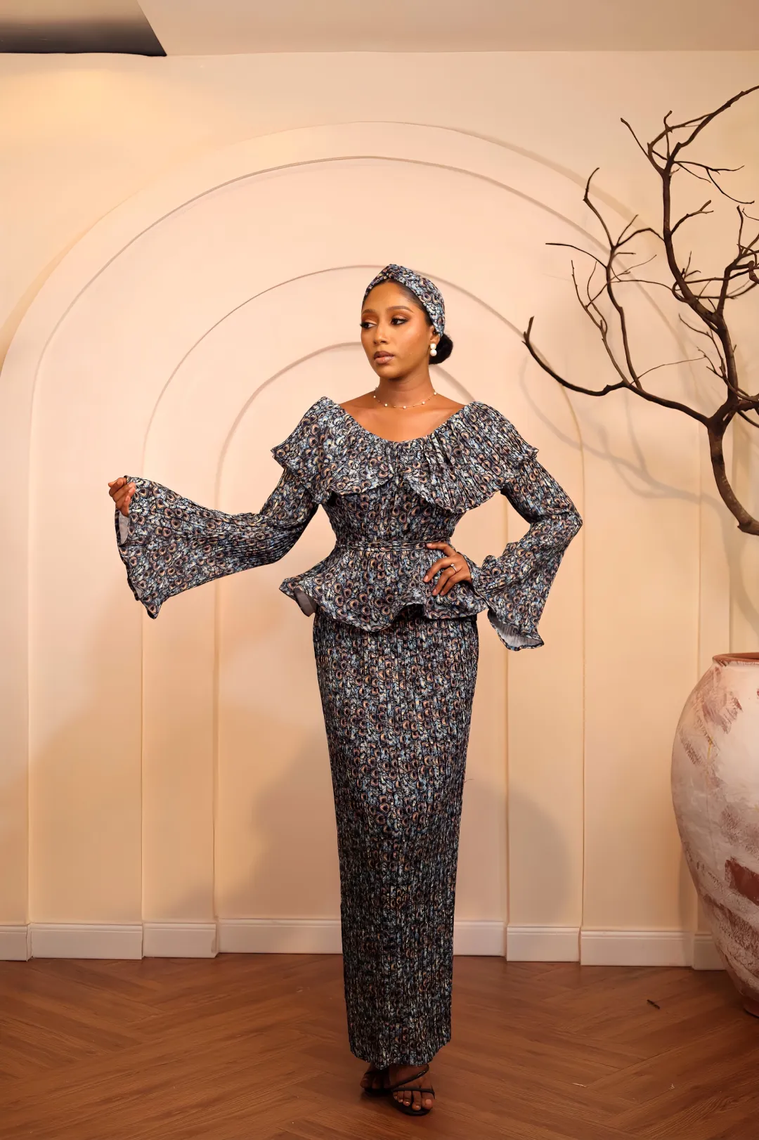 Peacock pleated peplum set by Kandé
